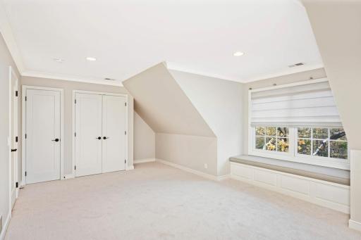 Second upstairs bedroom, spacious, lots of storage space and window seat for reading and relaxing.