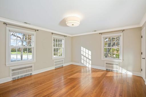 Main floor guest bedroom, tons of natural light, beautiful hardwood floors