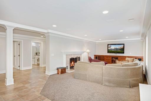 Lower level heated tile flooring and wood burning fireplace!