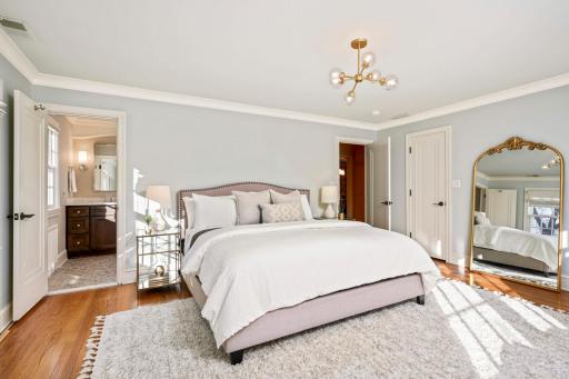 Main floor primary bedroom, beautiful hardwood floors, en suite bathroom.