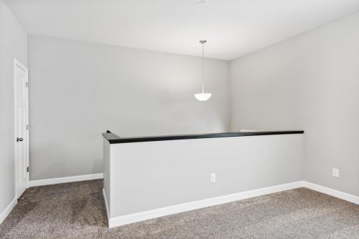 Entry into the home with a convenient coat closet at the top of the stairs. Photos are not of actual home. Actual home will be similar. Some colors and features may vary.