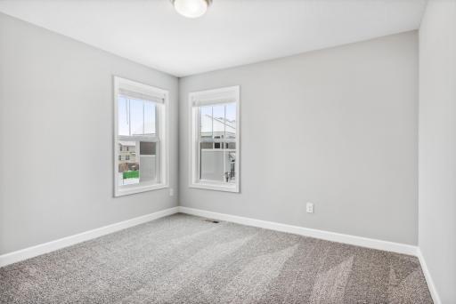 Second bedroom upstairs. Photos are not of actual home. Actual home will be similar. Some colors and features may vary.