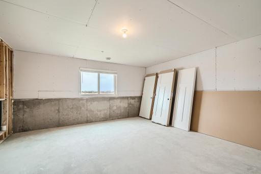 Large unfinished basement with plumbing rough-ins for future bath. Great space to finish or use unifinished for storage, workout room or other work space. Model home pictured with the same floorplan.