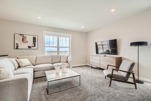 Living Room- Model home pictured with the same floorplan.
