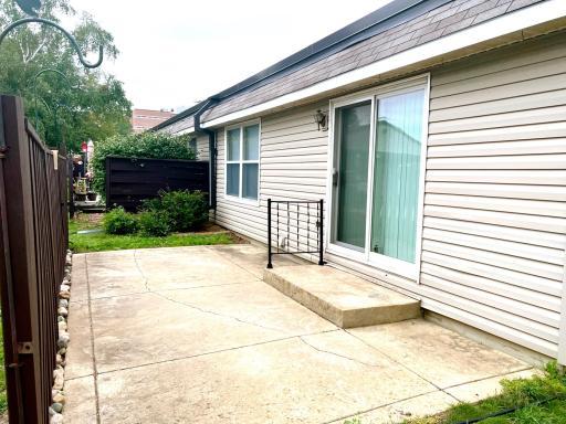 Patio doors lead to the kitchen and dining area.