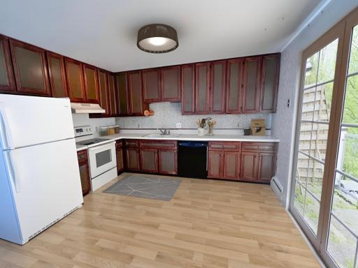 Virtually staged photo. The patio door faces south for lots of natural light.