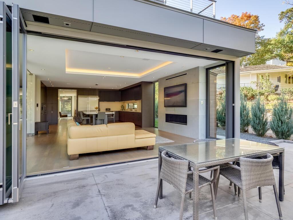 Family room walks out to a large deck overlooking the pool area.