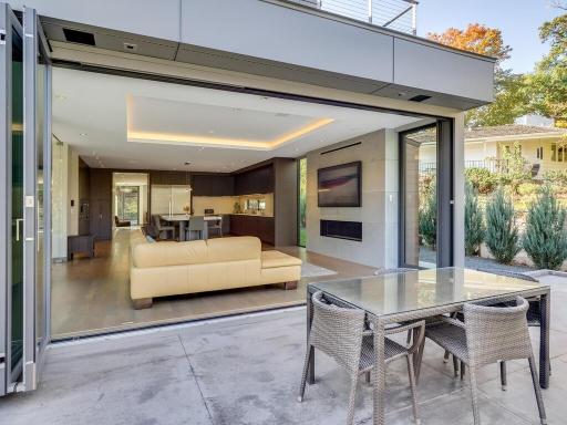 Family room walks out to a large deck overlooking the pool area.