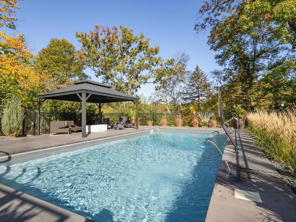 Fabulous salt water pool with extensive decking and Gazebo.