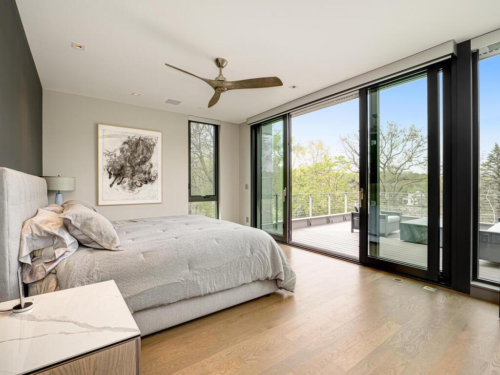 Primary Bedroom with private Deck overlooking the pool area