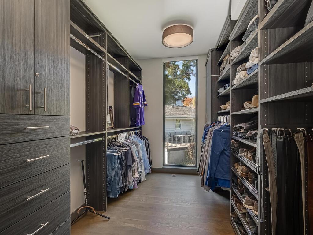 Primary Bedroom has 2 huge walk-in closets with custom cabinetry, locking drawers and shoe cabinets
