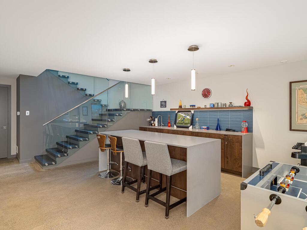 Walkout Level has a full Wet Bar with wine and beverage refrigerators