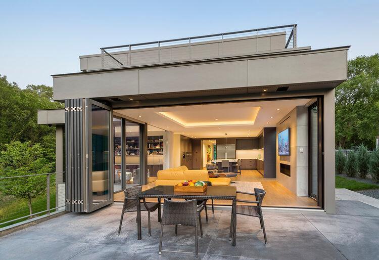 Full wall retractable door with double fantom screens brings the indoors out and the outdoors in!