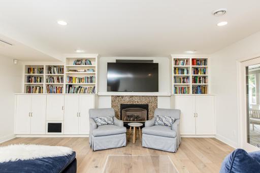 Expansive LL family room with built-ins and fireplace.jpg