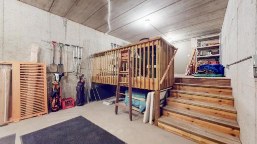 Storage - Lower Level. Decked area opens to backyard. Current owners use this space as a shed.