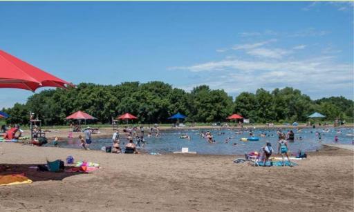The Elm Creek swim pond is filtered and chlorinated water with a sand beach. The beach also has a changing shelter concessions and bathroom facilities.