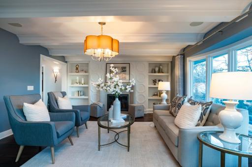 gas fireplace and built-ins in formal living area