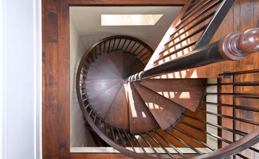 spiral staircase provides secondary access to upper level