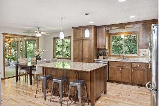 Photo for 899 Millwood Avenue, Roseville, MN 55113 - Listing #6423463 Its elegant design is not only visually striking but also highly functional, offering additional storage, a built-in wine rack, and even a cozy breakfast bar for casual meals.