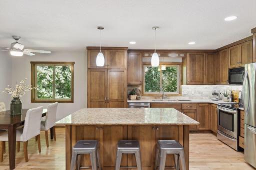 Photo for 899 Millwood Avenue, Roseville, MN 55113 - Listing #6423463 The centerpiece of this culinary masterpiece is a generously sized island, which serves as both a preparation zone and a gathering spot for family and friends.