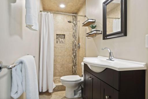 Photo for 899 Millwood Avenue, Roseville, MN 55113 - Listing #6423463 An en-suite bathroom offers convenience and a touch of luxury, ensuring a seamless morning routine.