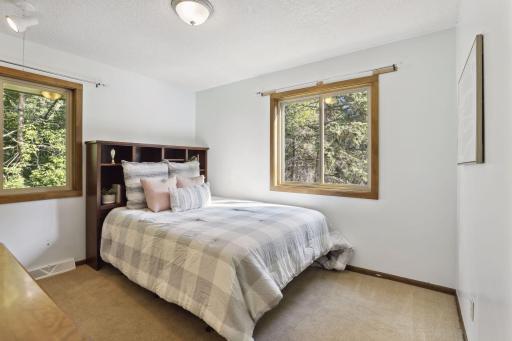Photo for 899 Millwood Avenue, Roseville, MN 55113 - Listing #6423463 Three additional bedrooms complete this home's ensemble, each designed with practicality in mind.