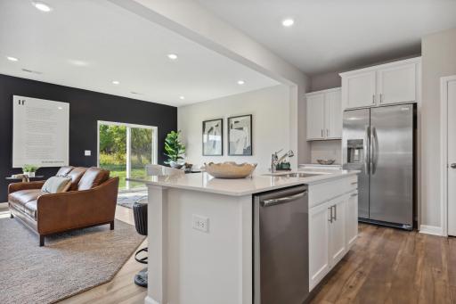 The open layout provides an optimal area to cook and entertain. Envision gathering together with friends and family in the heart of this home over the holidays!