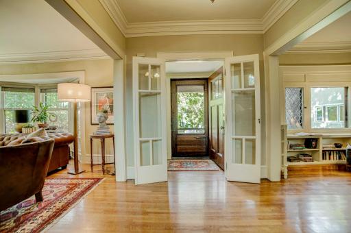 Elegant spacious front entry with original hardwood floors