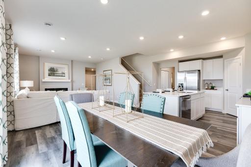 Dinette adjacent to the kitchen helps keep the conversation open and flowing from wherever you are on the main level. *Pictures are of a model home, actual colors and finishes may vary.