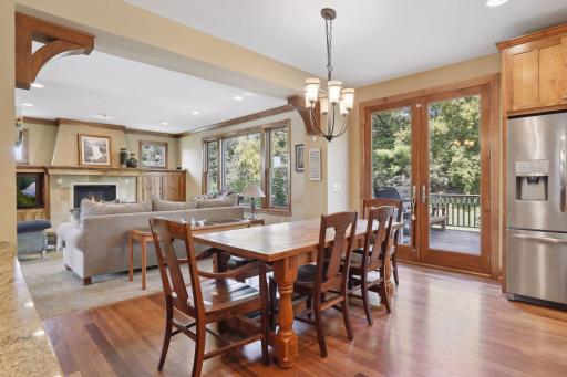 Ornate corbels serve as the gateway into the kitchen and informal dining area.