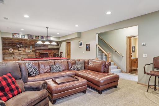 The finished look-out lower level boasts a large family room, which serves as the homeâs entertainment enclave.