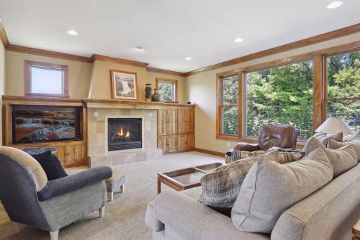The journey starts with the inviting great room, a space carefully curated for gathering and entertaining