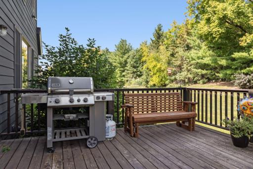 French doors from the informal dining beckon to the spacious deck