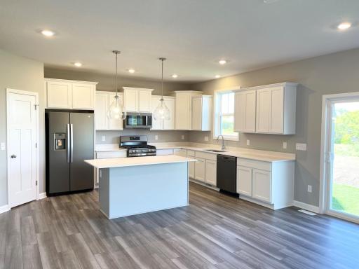 Beautiful and inviting kitchen that is perfect for entertaining family and friends.