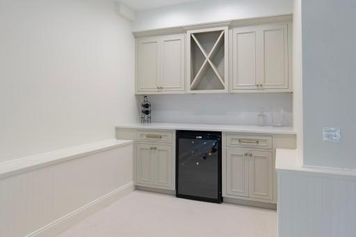 Lower level family/amusement room bar and beverage refrigerator