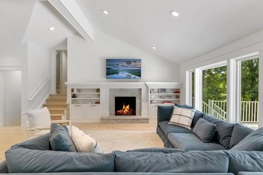 Family room with fireplace and deck views