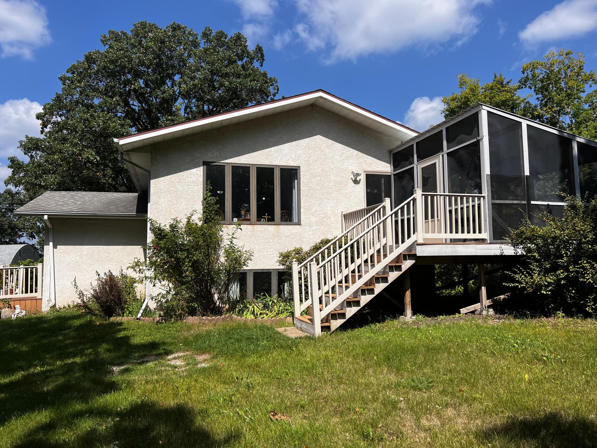 Deck and screen porch on the south side of the home