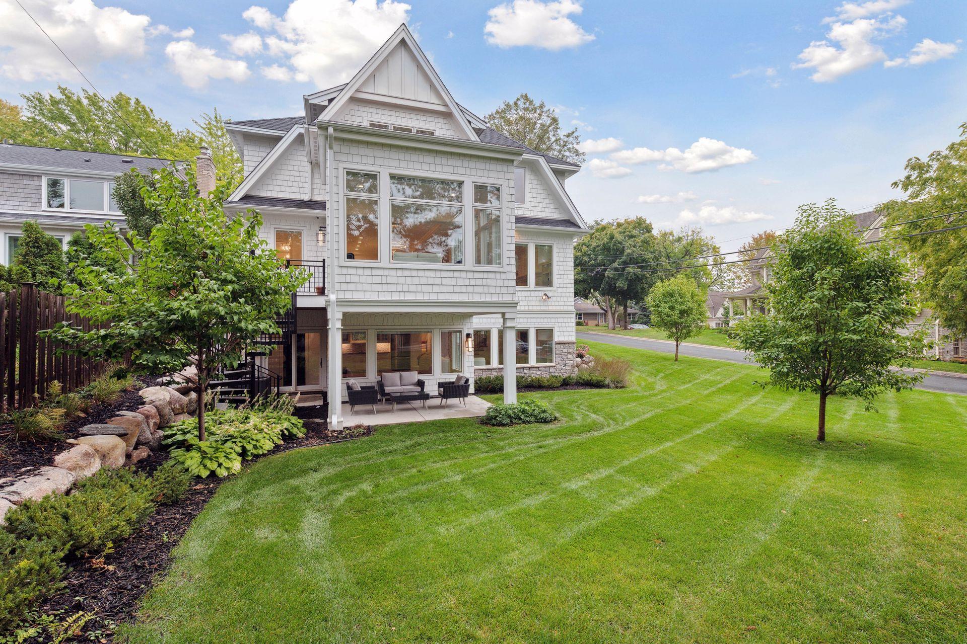 Back of home with a very big backyard