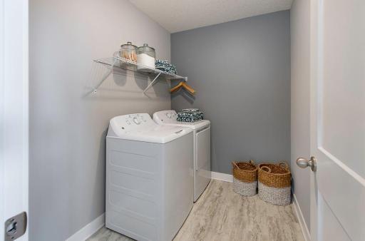 Convenient Upstairs Laundry Room - PICTURE OF MODEL HOME - COLORS AND OPTIONS WILL VARY
