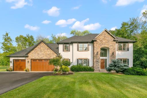 9427 Elm Court is a stunning home situated on 4.21 acres of private and picturesque landscape. This storybook setting includes an amazing outbuilding perfectly finished which compliments the grand two story.