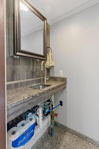 1/2 bath features suspended granite top w/ sink