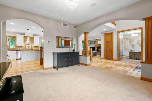 Arched openings to both the Kitchen and Foyer