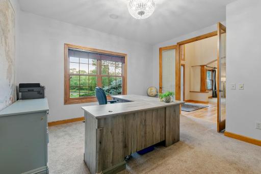 Full glass French doors opens to the office