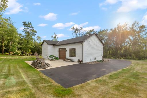 Additional concrete 34 x 24 parking pad in the back of the outbuilding