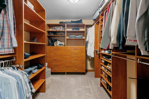 Walk-in closet w/ custom organizer and pocket door access