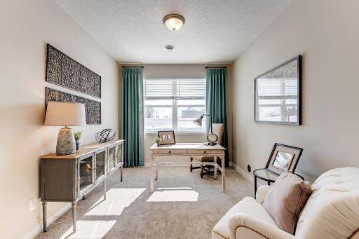 Second room on the main level gives our buyers flexibility for a guest bedroom, office, craft room - whatever you need! Room will be selected to be a 3rd bedroom. Staged model photos. See listing agent for home specific selections.