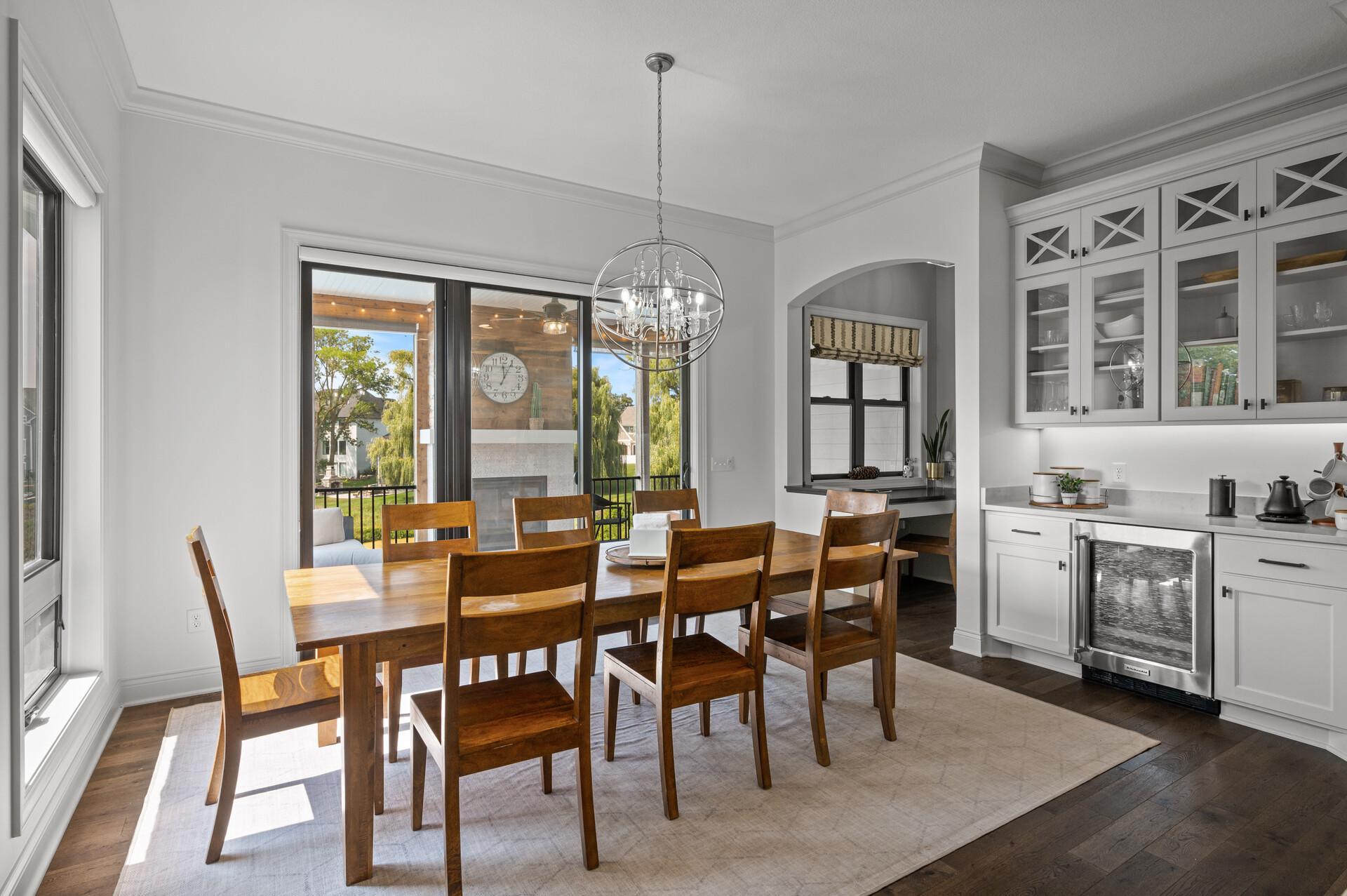 Adjoining dining space with easy access to the inviting screen porch, perfect for indoor-outdoor dining and entertaining.
