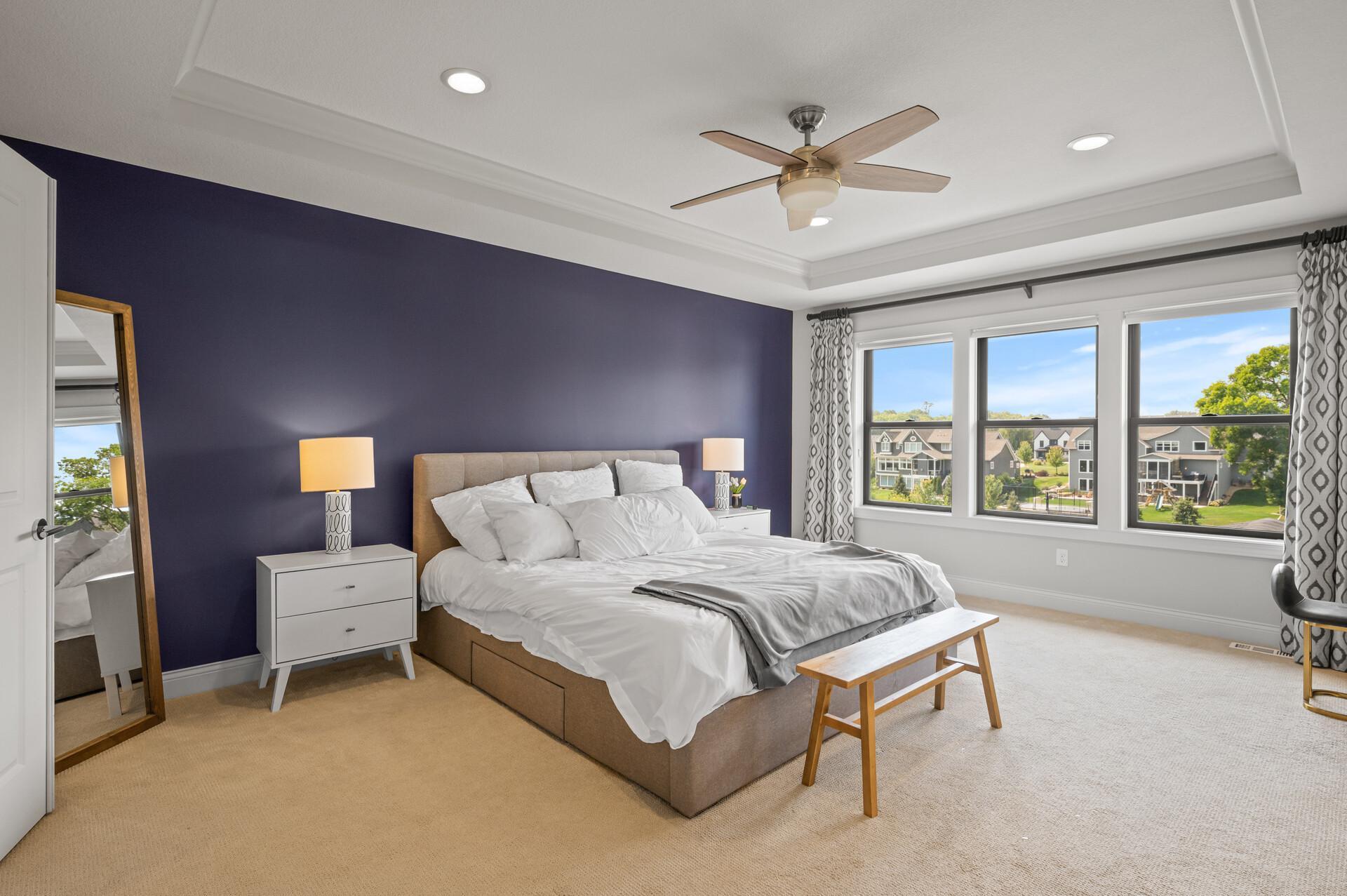 Luxurious primary suite featuring a custom walk-in closet and a lavish private bathroom.