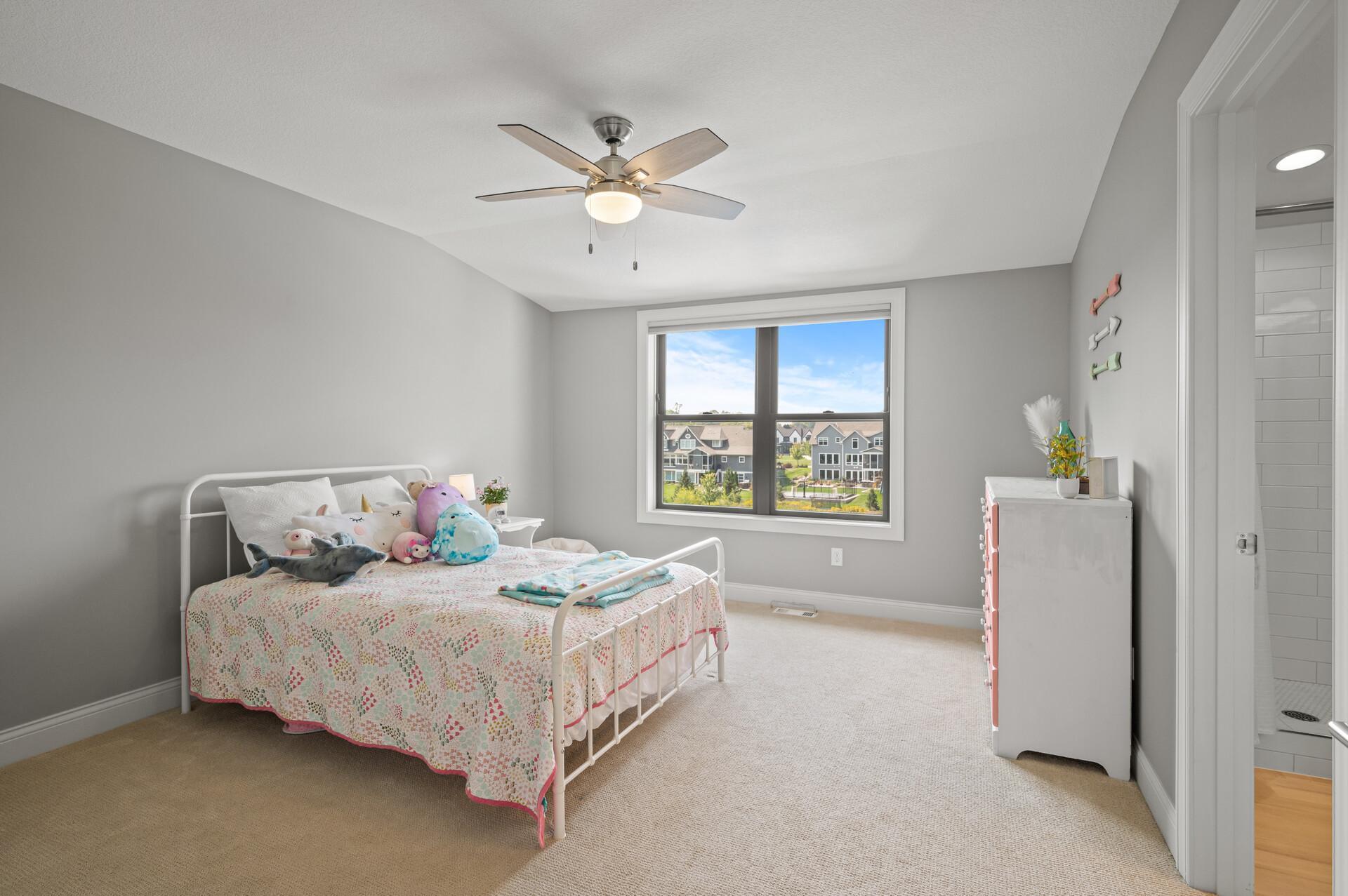 A third junior bedroom with its own private ensuite bathroom, offering a stylish and convenient space for guests or family members.