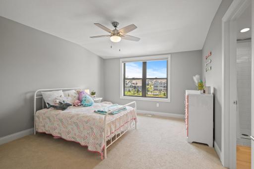 A third junior bedroom with its own private ensuite bathroom, offering a stylish and convenient space for guests or family members.
